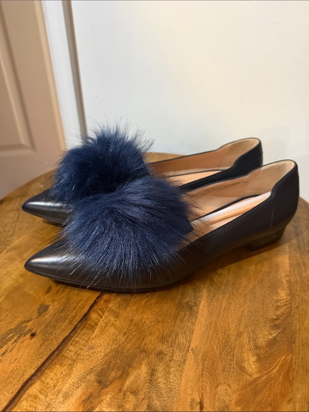Women's Navy Leather Pointed Toe Flats with Pom Accents
